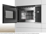 a black and silver oven with a door open