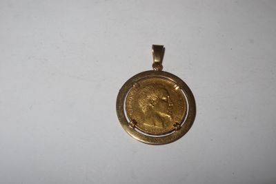 a close up of a gold coin on a white surface