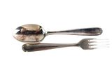 two spoons and a fork on a white surface