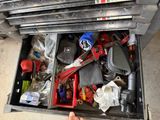 a drawer full of assorted items and tools