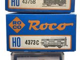 three boxes of roco ho trains are stacked on top of each other