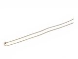 a close up of a pair of silver hair pins on a white background