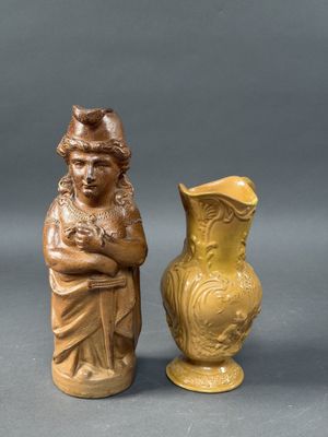 two vases sitting next to each other on a table