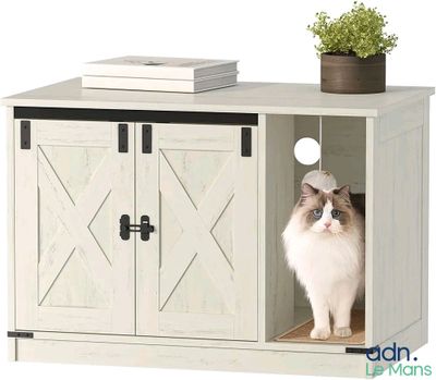 un chat assis à l'intérieur d'un petit meuble