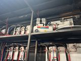many different types of electrical equipment on the shelves