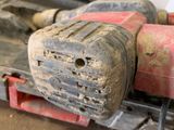 a close up of a piece of wood with a drill on it