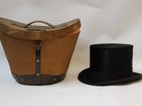 a hat and a suitcase on a white background