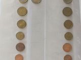 a lot of coins in a plastic bag on a table