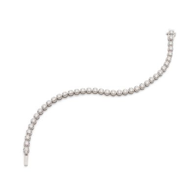 a close up of a diamond bracelet on a white background