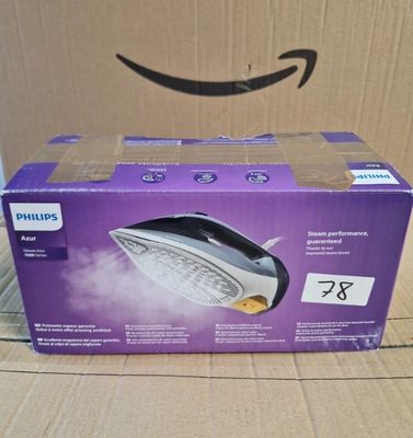 La boîte du fer à vapeur Philips est ouverte et prête à l'emploi.
