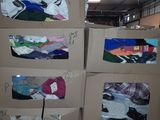 several cardboard boxes stacked on top of each other in a warehouse
