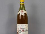a bottle of wine that is sitting on a table