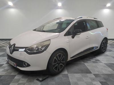 the white car is parked on a checkered floor in the garage