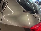 a close up of a car with a sticker on the back of it