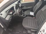 the interior of a car with a steering wheel and a dashboard