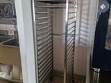 an image of a commercial kitchen with stainless steel racks
