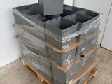 a stack of plastic containers sitting on a pallet