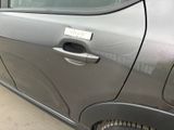 a silver car with a sticker on the side of it