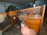 a blurry photo of a kitchen with a sink and cabinets