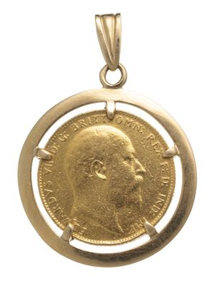 gros plan d'une pièce d'or sur laquelle figure le visage d'un homme