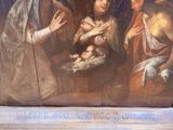a painting of a woman holding a baby in a manger
