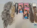 many different types of wigs on display on a table