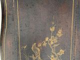 a small table with a bird design on it
