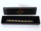 a close up of a box with a bracelet inside of it