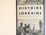 an old book with a picture of a city in the middle of it