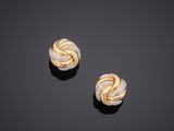 a pair of gold and diamond earrings
