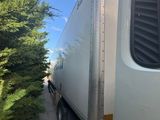 a white truck that is driving down the road
