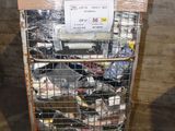 a metal cart with a bunch of items in it