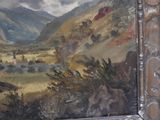 a painting on the wall of a building with mountains in the background