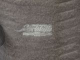 a close up of a piece of cloth with a logo on it