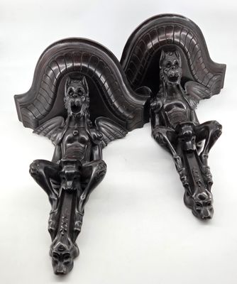 pair of antique cast iron wall sconces of a woman and child