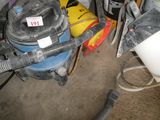 an image of a room with a vacuum and other items