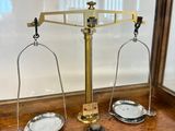a scale that is sitting on a wooden table