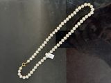 pearl beaded necklace with a gold clasp and a white pearl bead necklace with a gold clasp and a white pearl bead necklace with a white pearl bead