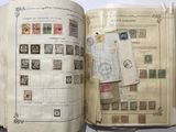 an open book with a lot of stamps on it