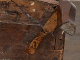 an old wooden chest with a handle on it