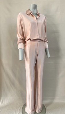 an image of a mannequin wearing a pink shirt and pants