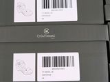 several boxes of different types of shoes are stacked on top of each other