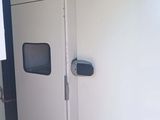 a white refrigerator in the corner of a room