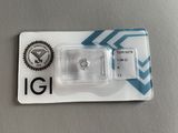 an image of a single diamond in a package on top of a table