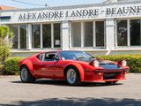 a red sports car parked in front of a building