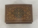 an old wooden box with a decorative design on it