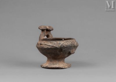 an image of a brown vase with a bird on it