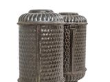 pair of antique metal canisters on white background with copy space