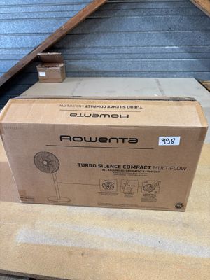 boxes are stacked on a table in a room with a metal roof