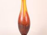a vase that is sitting on a white surface